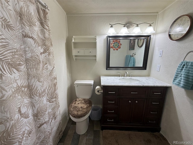21300 County Road 13, La Jara, CO 81140 - full bath with a textured wall, vanity, ornamental molding, and toilet