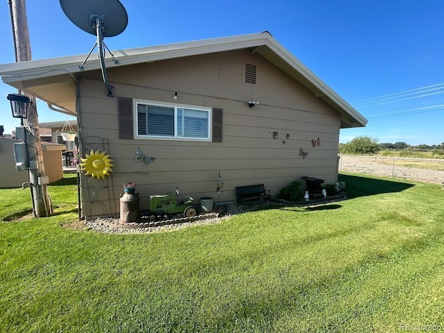 21300 County Road 13, La Jara, CO 81140 - view of side of home featuring a lawn