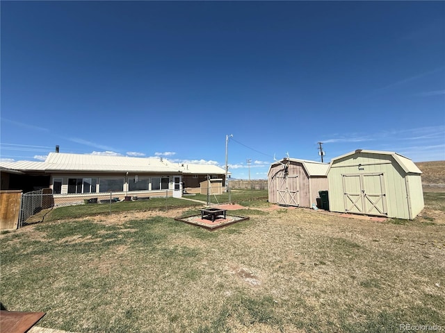 21300 County Road 13, La Jara, CO 81140 - view of yard with a fire pit, an outdoor structure, fence, and a storage shed