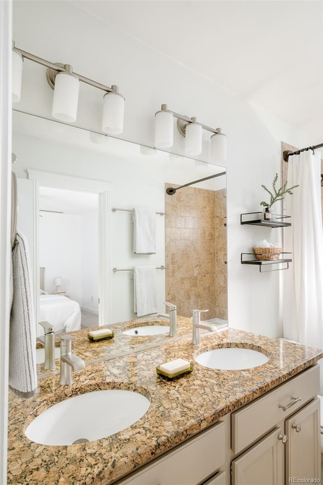 bathroom with a shower with curtain and vanity