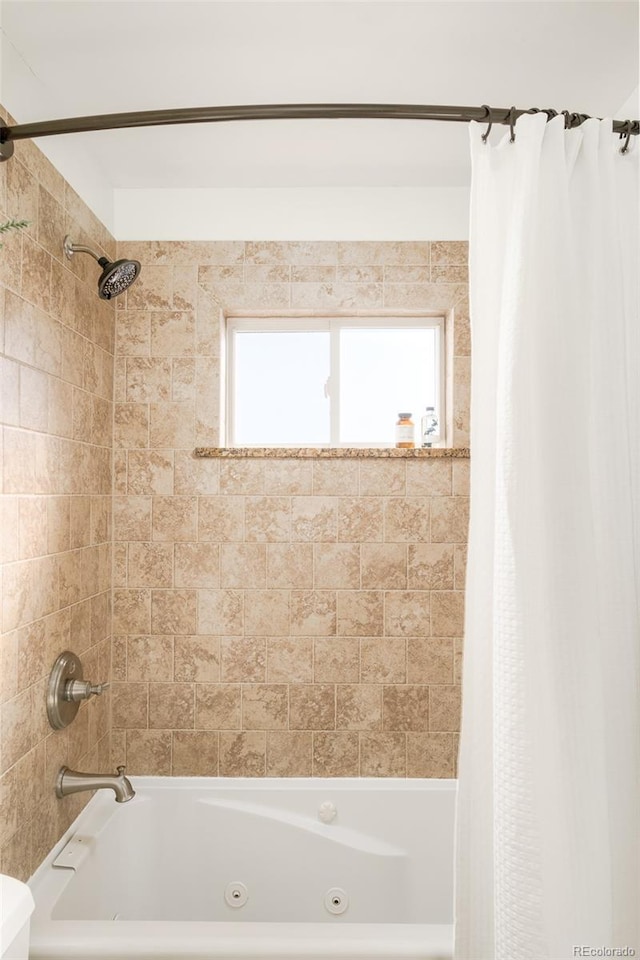 bathroom featuring shower / bath combo with shower curtain