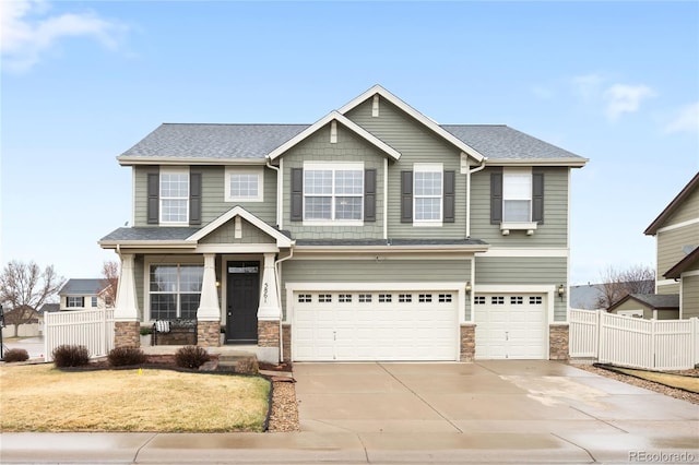 5861 Mt Shadows Blvd, Firestone, CO 80504 - craftsman-style home with concrete driveway, an attached garage, stone siding, and roof with shingles