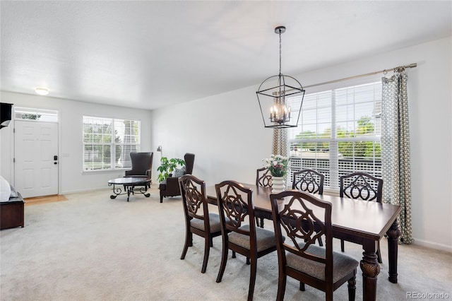 5861 Mt Shadows Blvd, Firestone, CO 80504 - dining space featuring a chandelier, baseboards, and light colored carpet