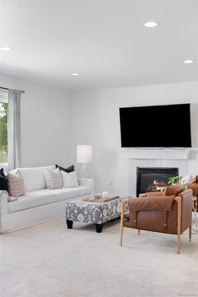 5861 Mt Shadows Blvd, Firestone, CO 80504 - carpeted living area featuring a tile fireplace and recessed lighting