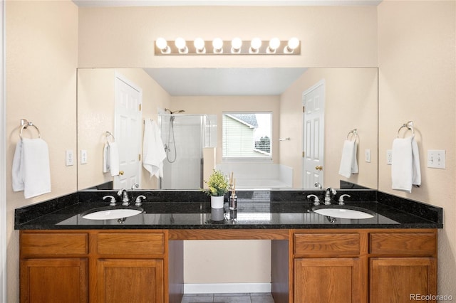 5861 Mt Shadows Blvd, Firestone, CO 80504 - full bath with a stall shower, a garden tub, double vanity, and tile patterned flooring