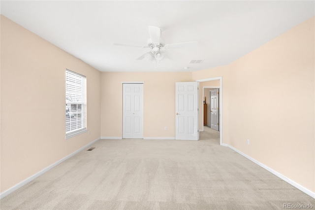 5861 Mt Shadows Blvd, Firestone, CO 80504 - unfurnished bedroom with light carpet, baseboards, a closet, and ceiling fan