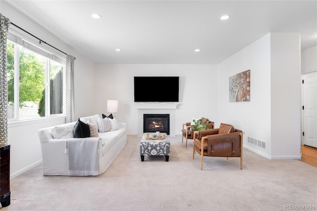 5861 Mt Shadows Blvd, Firestone, CO 80504 - living area featuring carpet, recessed lighting, and a glass covered fireplace