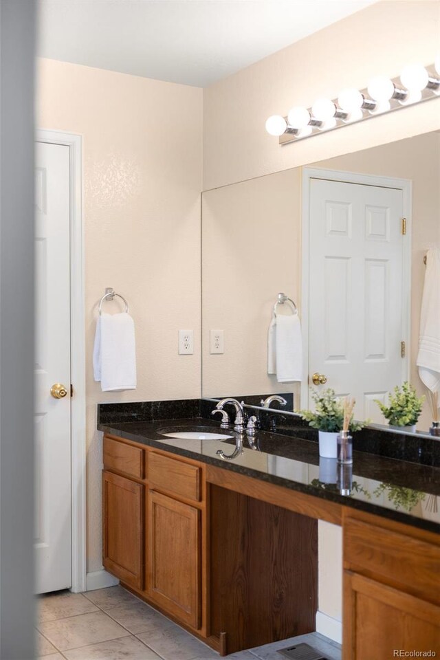 5861 Mt Shadows Blvd, Firestone, CO 80504 - bathroom with vanity and tile patterned flooring