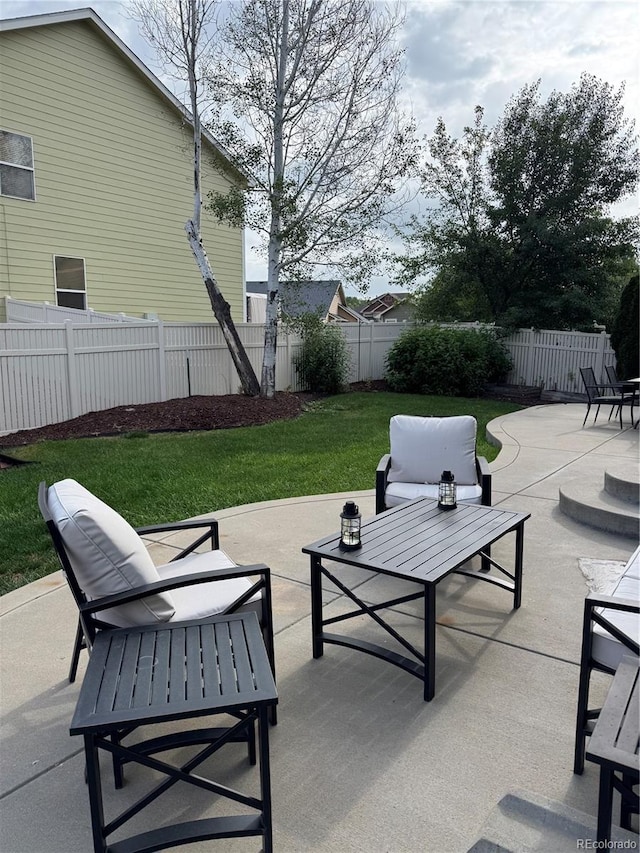 5861 Mt Shadows Blvd, Firestone, CO 80504 - fenced backyard featuring a patio area and outdoor lounge area