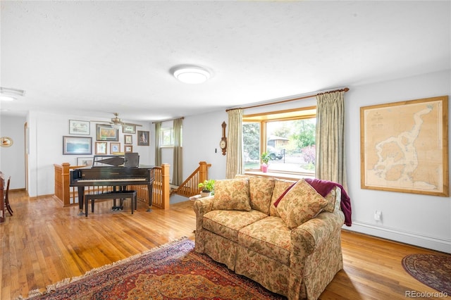 9045 W Ithaca Pl, Denver, CO 80235 - living area with light wood-style floors, ceiling fan, and baseboards