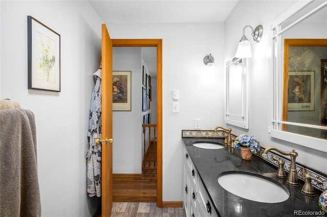 9045 W Ithaca Pl, Denver, CO 80235 - full bathroom featuring wood finished floors and double vanity