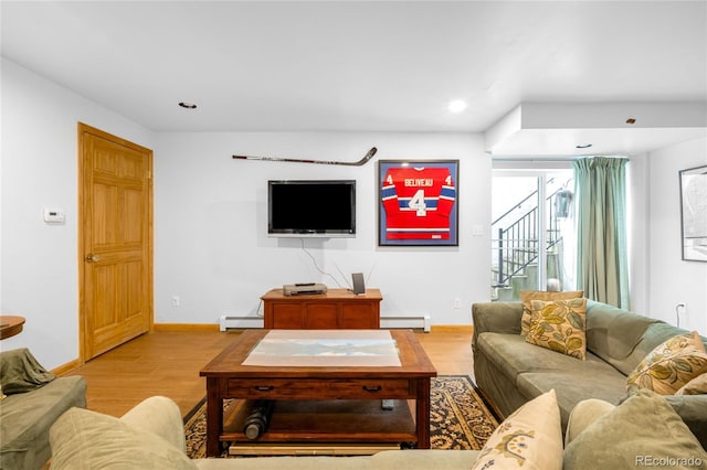 9045 W Ithaca Pl, Denver, CO 80235 - living room featuring light wood-type flooring, stairway, baseboard heating, baseboards, and recessed lighting