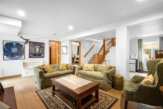 9045 W Ithaca Pl, Denver, CO 80235 - living room with stairs, light wood finished floors, recessed lighting, and baseboards