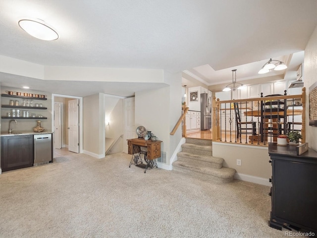 interior space with bar, light carpet, baseboards, stairs, and crown molding