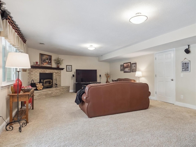 carpeted living room featuring baseboards and a brick fireplace