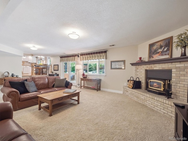carpeted living area with a textured ceiling and baseboards