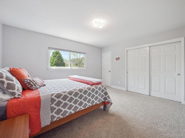 carpeted bedroom with a closet