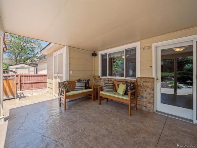 view of patio with fence and an outdoor hangout area