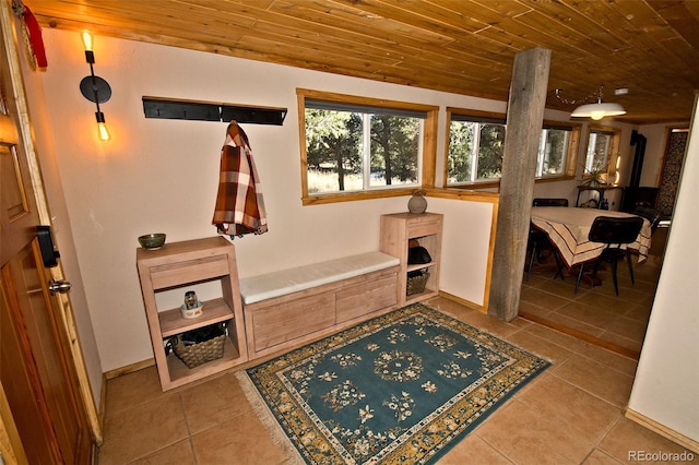 mudroom with light tile patterned flooring and wood ceiling