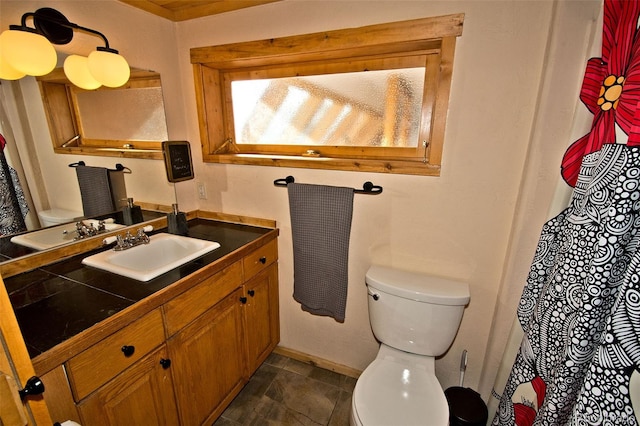 bathroom with vanity and toilet