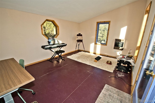 workout area featuring heating unit and lofted ceiling