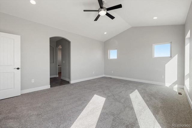 unfurnished room featuring carpet floors, vaulted ceiling, and ceiling fan