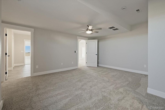 empty room with light colored carpet and ceiling fan