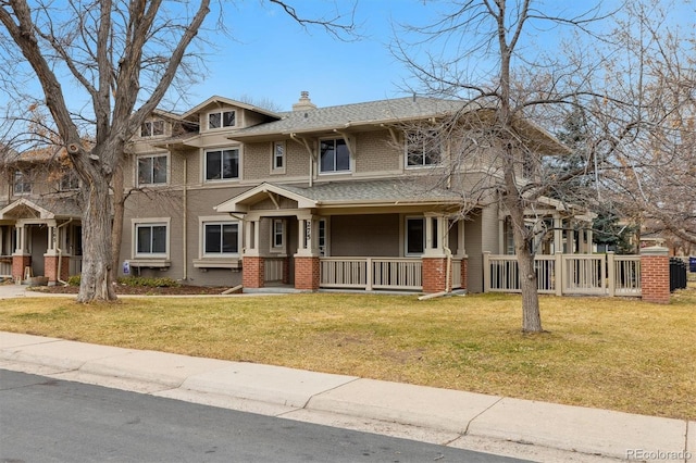 275 Pontiac St, Denver, CO 80220 - view of front of house featuring brick siding, a front yard, roof with shingles, covered porch, and a chimney