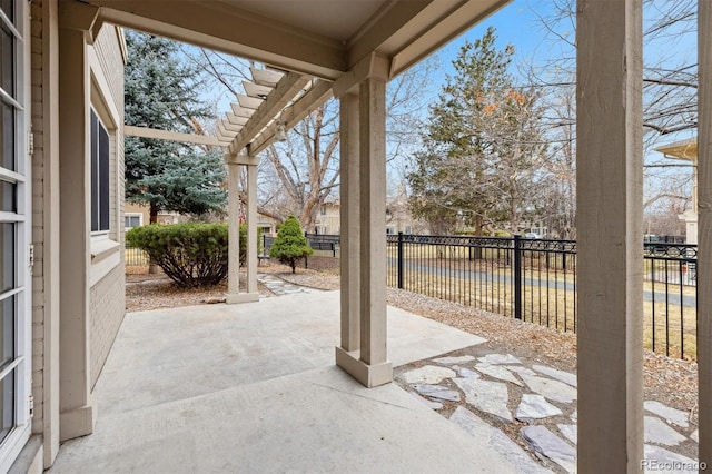 view of patio featuring fence