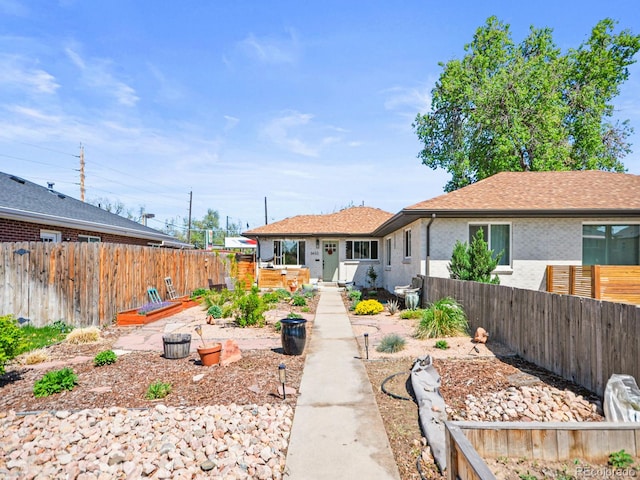 3450 N Harrison St, Denver, CO 80205 - rear view of house featuring a fenced backyard