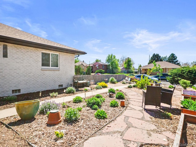 3450 N Harrison St, Denver, CO 80205 - view of yard with fence, a patio area, and a residential view