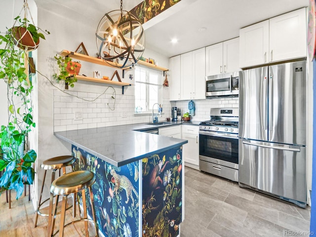 3450 N Harrison St, Denver, CO 80205 - kitchen with white cabinetry, stainless steel appliances, open shelves, and a sink