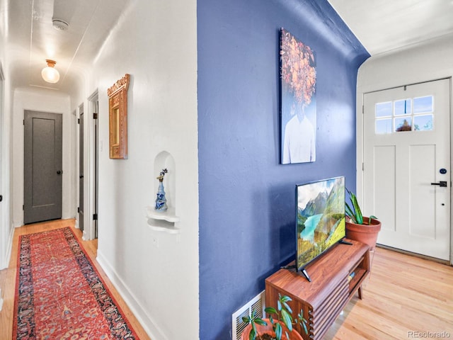 3450 N Harrison St, Denver, CO 80205 - foyer entrance with light wood-style floors, visible vents, and baseboards