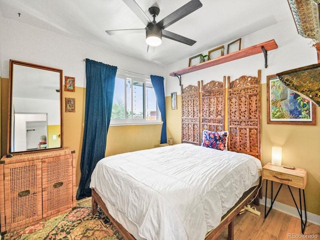 3450 N Harrison St, Denver, CO 80205 - bedroom with baseboards, ceiling fan, and wood finished floors