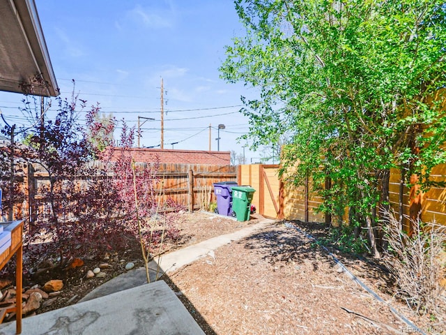 3450 N Harrison St, Denver, CO 80205 - view of yard featuring a fenced backyard