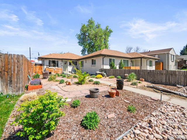 3450 N Harrison St, Denver, CO 80205 - rear view of house with a patio, brick siding, and a fenced backyard