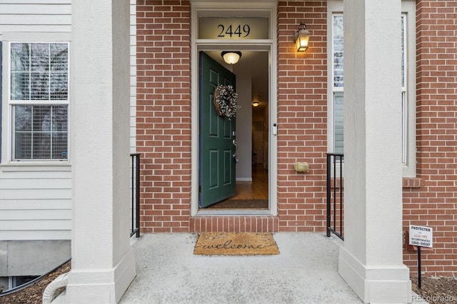 entrance to property with brick siding