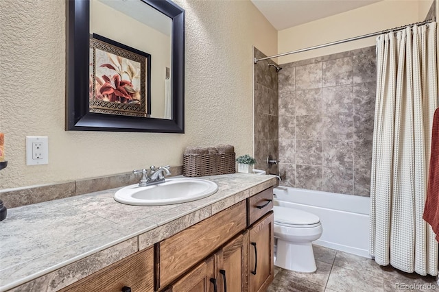 bathroom with shower / tub combo, a textured wall, toilet, tile patterned floors, and vanity