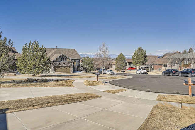 view of road with a residential view and sidewalks