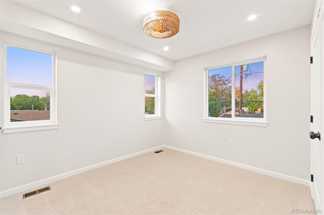 1048 Knox Ct, Denver, CO 80204 - carpeted spare room with baseboards and recessed lighting