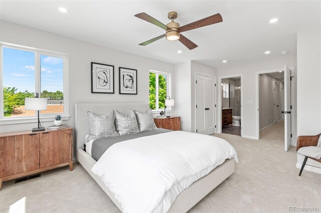 1048 Knox Ct, Denver, CO 80204 - bedroom with light colored carpet, recessed lighting, connected bathroom, and a ceiling fan