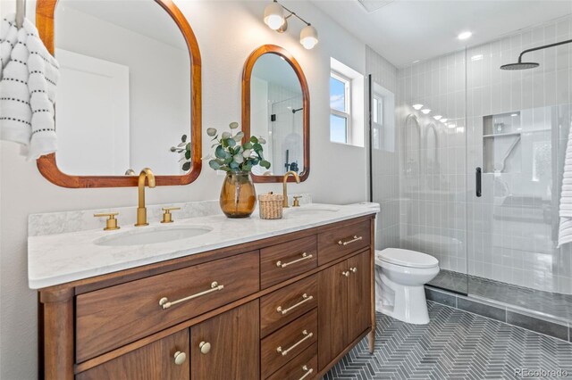 1048 Knox Ct, Denver, CO 80204 - full bathroom with double vanity, tiled shower, and tile patterned flooring