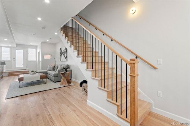 1048 Knox Ct, Denver, CO 80204 - stairs with wood finished floors and recessed lighting