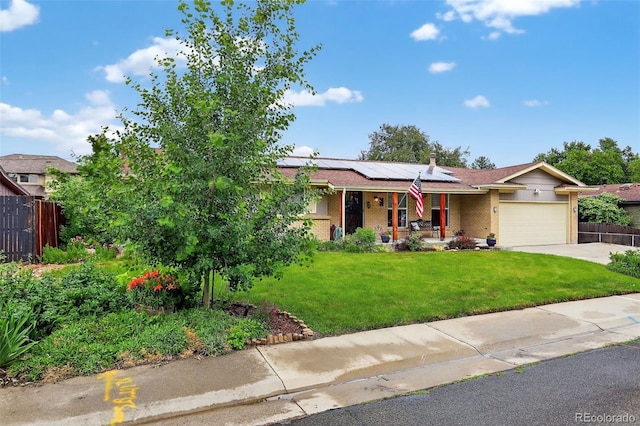 11835 W 37th Pl, Wheat Ridge, CO 80033 - ranch-style house with a porch, solar panels, an attached garage, driveway, and brick siding