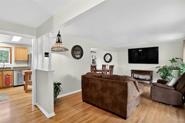 11835 W 37th Pl, Wheat Ridge, CO 80033 - living room featuring light wood-style flooring and baseboards
