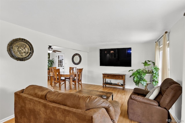 11835 W 37th Pl, Wheat Ridge, CO 80033 - living area with light wood-type flooring, healthy amount of natural light, and a ceiling fan