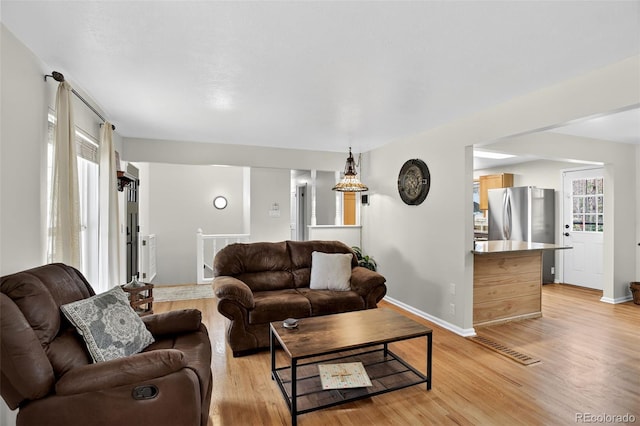 11835 W 37th Pl, Wheat Ridge, CO 80033 - living area featuring light wood-type flooring and baseboards