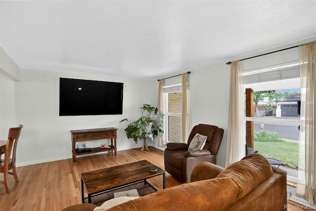 11835 W 37th Pl, Wheat Ridge, CO 80033 - living room featuring plenty of natural light and light wood-style flooring