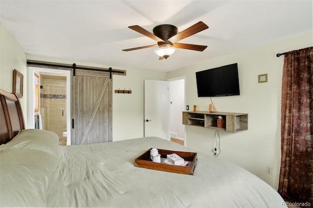 11835 W 37th Pl, Wheat Ridge, CO 80033 - bedroom featuring a barn door, ensuite bathroom, and a ceiling fan