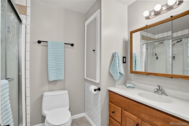 11835 W 37th Pl, Wheat Ridge, CO 80033 - bathroom with a shower stall, vanity, and tile patterned floors